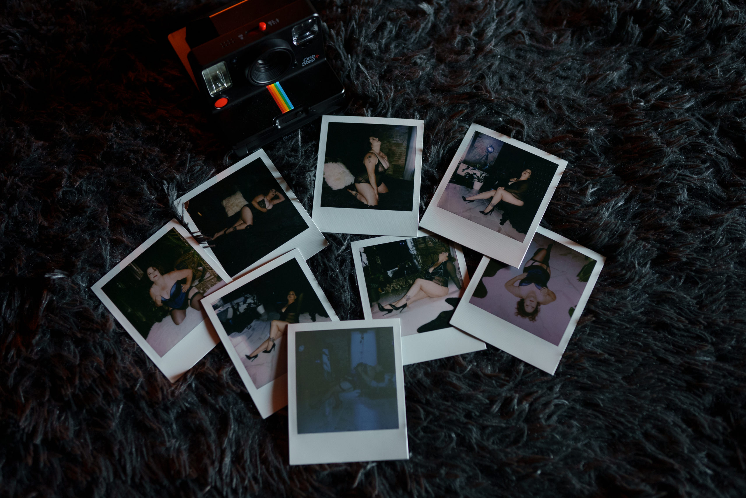 Polaroid Snapshots of Boudoir Photos and a camera are shown on a dark grey background.